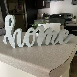 Gray “Home” sign